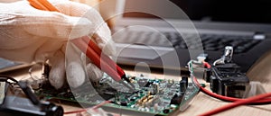 The technician testing a circuit board with precision tools and a laptop. AI generated image