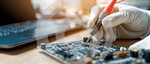 The technician testing a circuit board with precision tools in a modern workspace. AI generated image