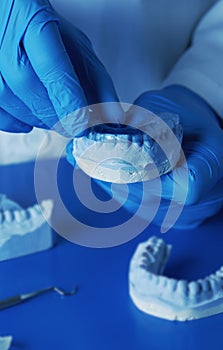 technician tests an occlusal splint photo