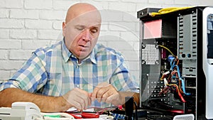 Technician Thinking How to Repair a Computer and Gesticulate Disappointed