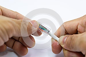 Technician to install an RJ45 connector on a CAT5 Ethernet network Patch Cable