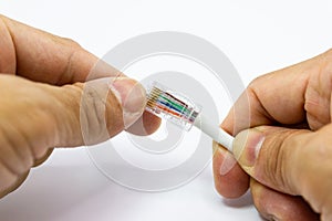 Technician to install an RJ45 connector on a CAT5 Ethernet network Patch Cable