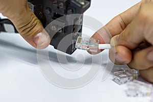 Technician to install an RJ45 connector on a CAT5