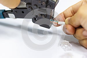 Technician to install an RJ45 connector on a CAT5