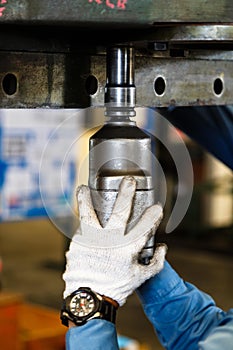 Technician use pneumatic torque wrench for tighten bolt photo