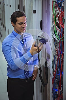 Technician using digital cable analyzer