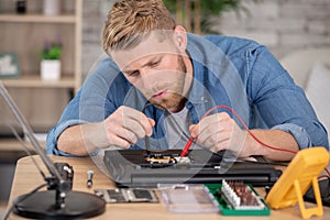 technician using voltage meter for voltage measurement