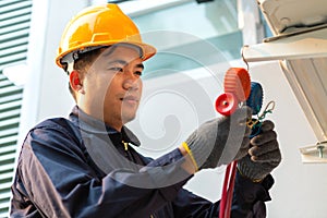 Technician vacuum pump evacuates and checking air conditioner, After-sales service concept