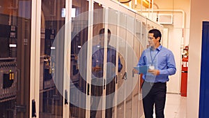 Technician walking in server room