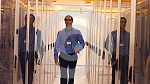 Technician walking in server room