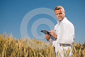 Technician in a wheat field