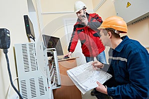 Technician worker adjusting video surveillance system