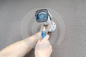 Technician worker installing video CCTV camera