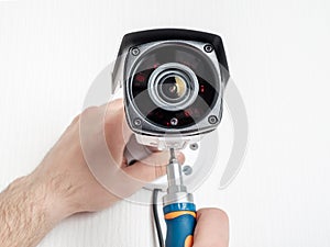 Technician worker installing video CCTV camera