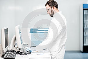 Technician working with analyzer machine