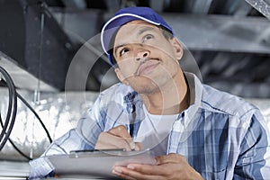 technician working on ceiling