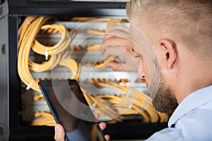 Technician Working On Server In The Data Center