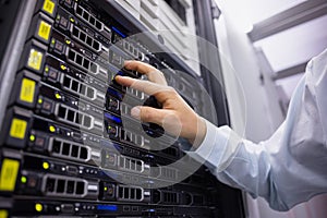 Technician working on server tower