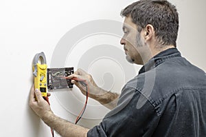 Technician working on a thermostat