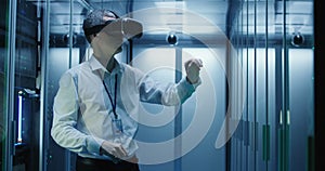 Technician works in a data center wearing a VR headset