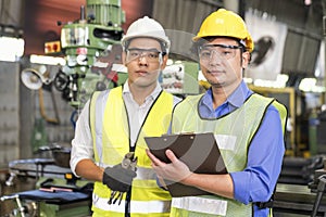 A technician with a wrench, locking pliers and a file. factory workers using machine equipment in workshop. Asian mechanical