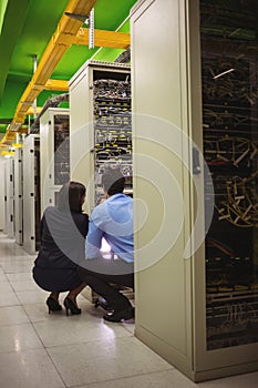 Technicians analyzing server