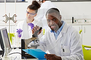 Technicians Carrying Out Research In Laboratory