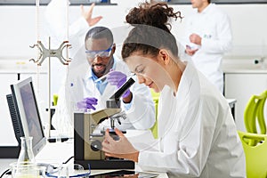 Technicians Carrying Out Research In Laboratory photo