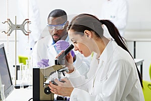 Technicians Carrying Out Research In Laboratory photo