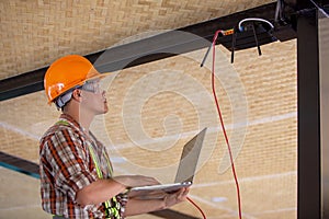 Technicians check the IP settings of the internet router system in the building with a lab