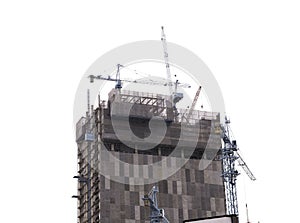 Technicians are constructing multi-storey buildings with machinery to facilitate on isolated background