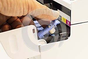 Technicians are Cover the fill hole with a seal of an inkjet printer, the device of office automate for printing