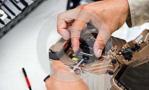 Technicians cutting fiber optic cables.