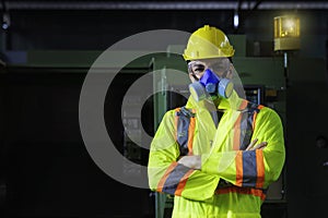 Technicians and engineers are working on machines in a factory.  Caucasian man wear safety clothing in the industry