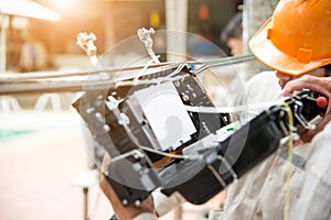 Technicians install fiber optic carbinet.