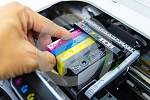 Technicians are install setup the ink cartridge or inkjet cartridge