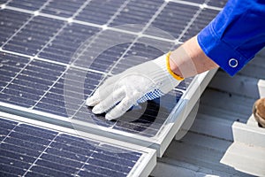 Technicians are installing and inspecting standards of solar panels on roof of an industrial factory. Electrical energy obtained