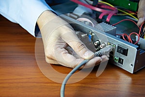 Technicians installing LAN cables at CCTV camera recorders