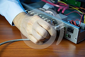 Technicians installing LAN cables at CCTV camera recorders