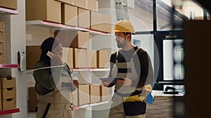 Technicians preparing warehouse delivery