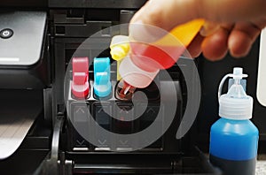 Technicians Refill ink cartridges, printer Inkjet colors.Printer Repairs and Maintenance inkjet or Laser printers concept