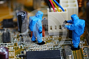 Technicians repair on computer mainboard.