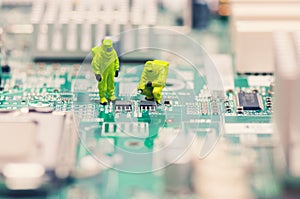 Technicians repairing circuit board photo