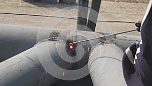 Technicians are welding the factory roof steel structure.