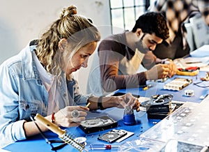 The technicians are working on computer electronics parts