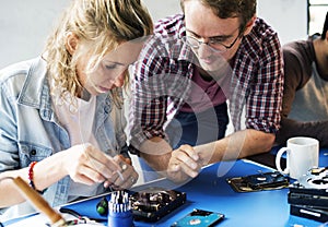 Technicians working on computer hard disk