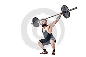 The technique of doing an exercise of deadlift with a barbell of a muscular strong tattooed bearded sports men on a