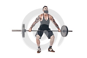 The technique of doing an exercise of deadlift with a barbell of a young strong bearded sports men on a white isolated