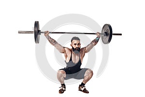 The technique of doing an exercise of deadlift with a barbell of a young strong bearded sports men on a white isolated