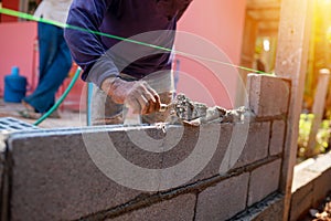 Techniques for cement masonry for the construction of building wall photo